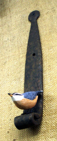 Nut Hatch on a Hinge -  carvings by Manfred Scheel